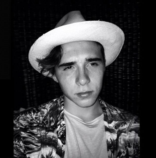 Brooklyn Beckham on his holidays, wearing a hat