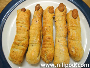 Photo showing a plate of cheese straws, made to look like fingers