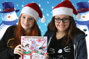 Photo of girls with Dan and Phil advent calendar and Christmas snowmen