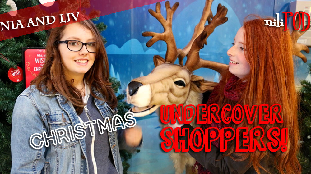 Christmas shoppers with a model singing reindeer