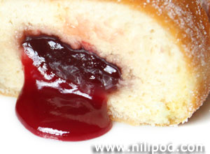 Picture of jam doughnut sliced in half to show jam inside