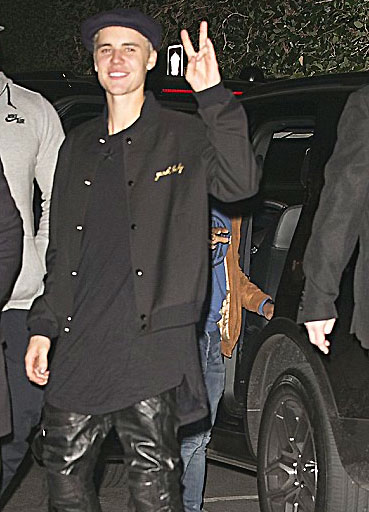 Image of Justin Bieber wearing baggy leather trousers