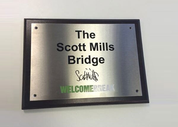Picture of the Scott Mills Bridge plaque at Fleet Services