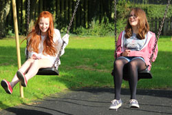 Girls on swings at playground